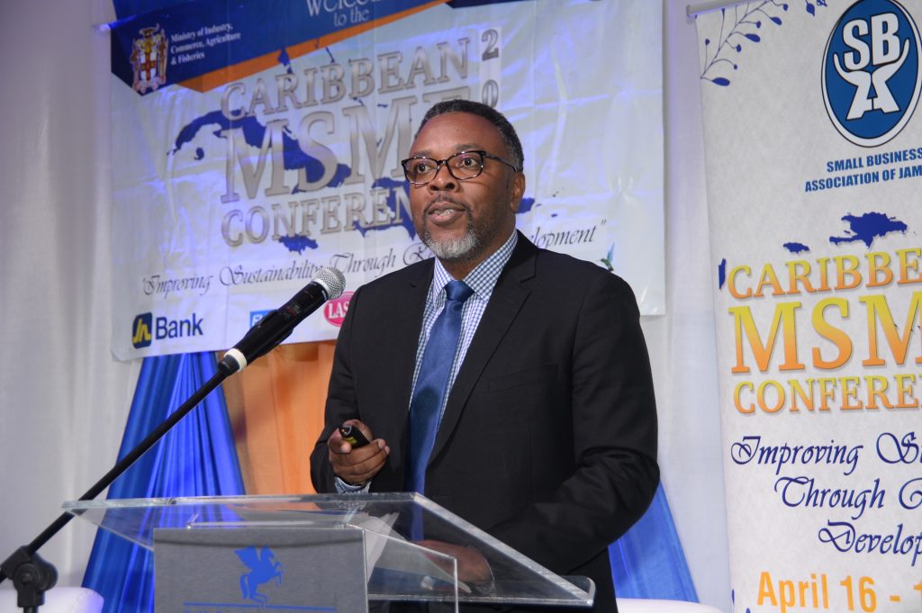 Dwayne Russell, general manager, MC Systems, a member company of The Jamaica National Group addressing Caribbean MSME Conference 2019.