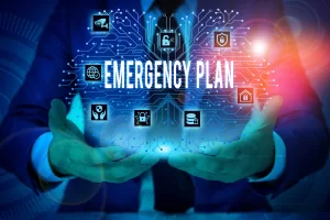 Hands cupped under a blue circuit-network background with icons and the text 'EMERGENCY PLAN' visible, illustrating preparedness ideas (informational).